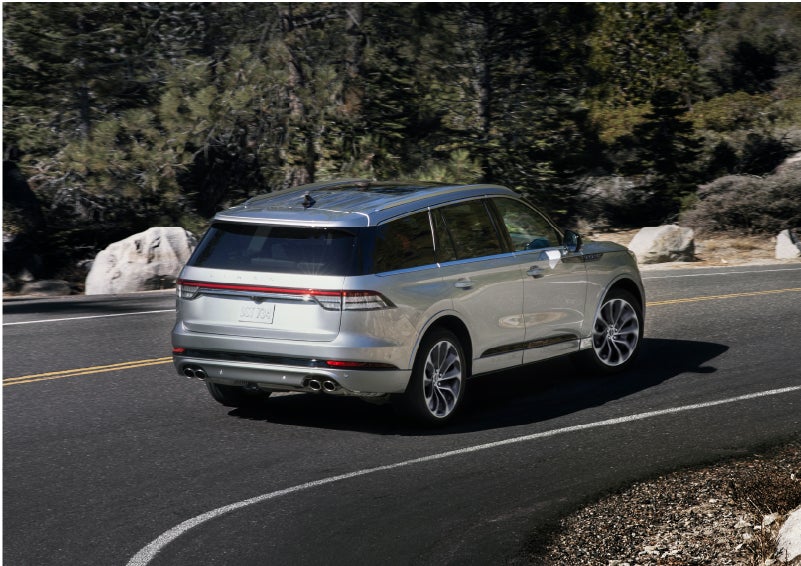 A Lincoln Aviator® is being driven on a winding road | Brinson Lincoln of Athens in Athens TX