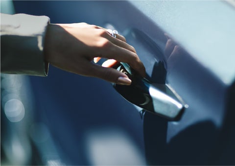 A hand gracefully grips the Light Touch Handle of a 2023 Lincoln Aviator® SUV to demonstrate its ease of use | Brinson Lincoln of Athens in Athens TX